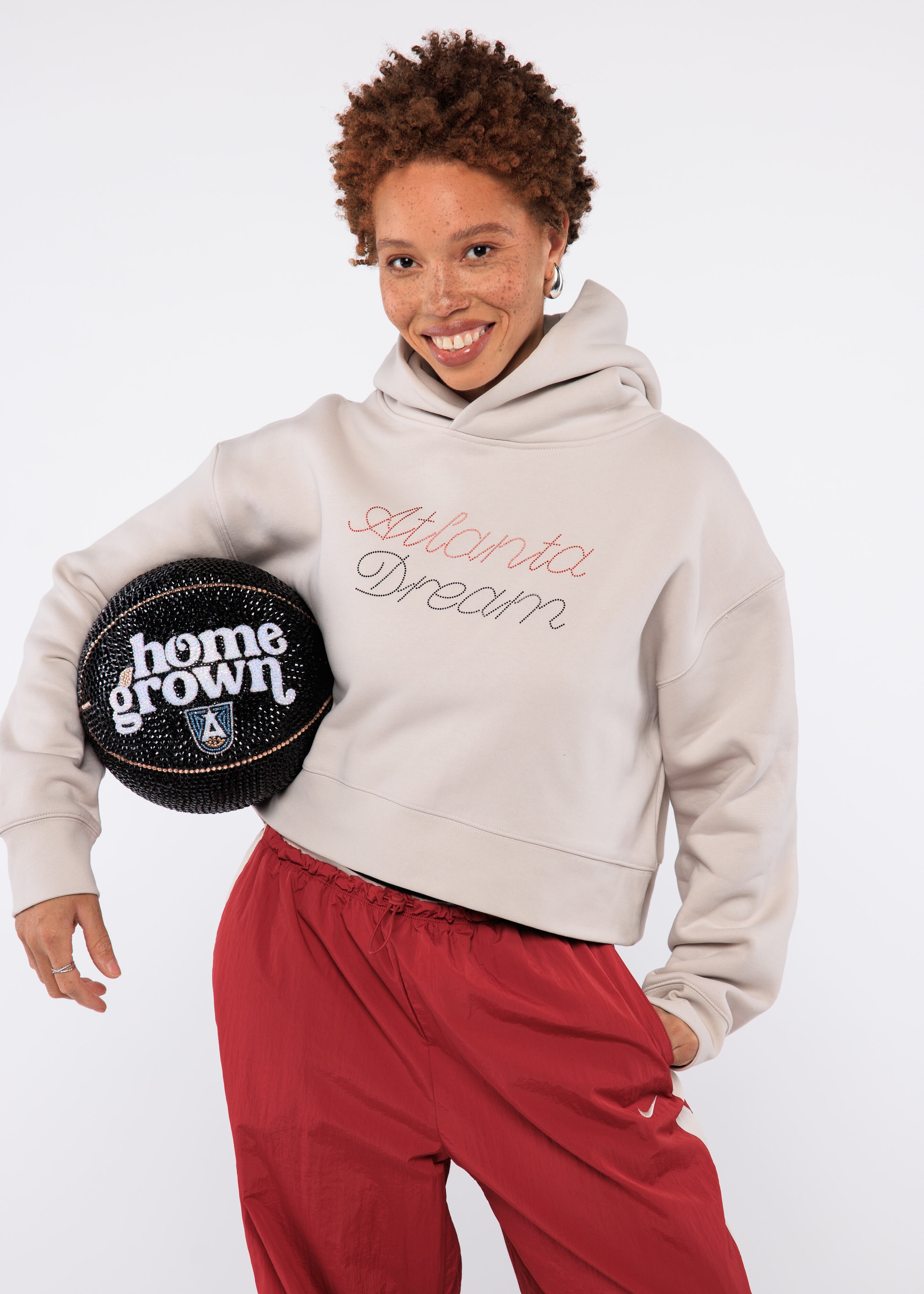 Woman in sweatshirt with "Atlanta Dream" on it