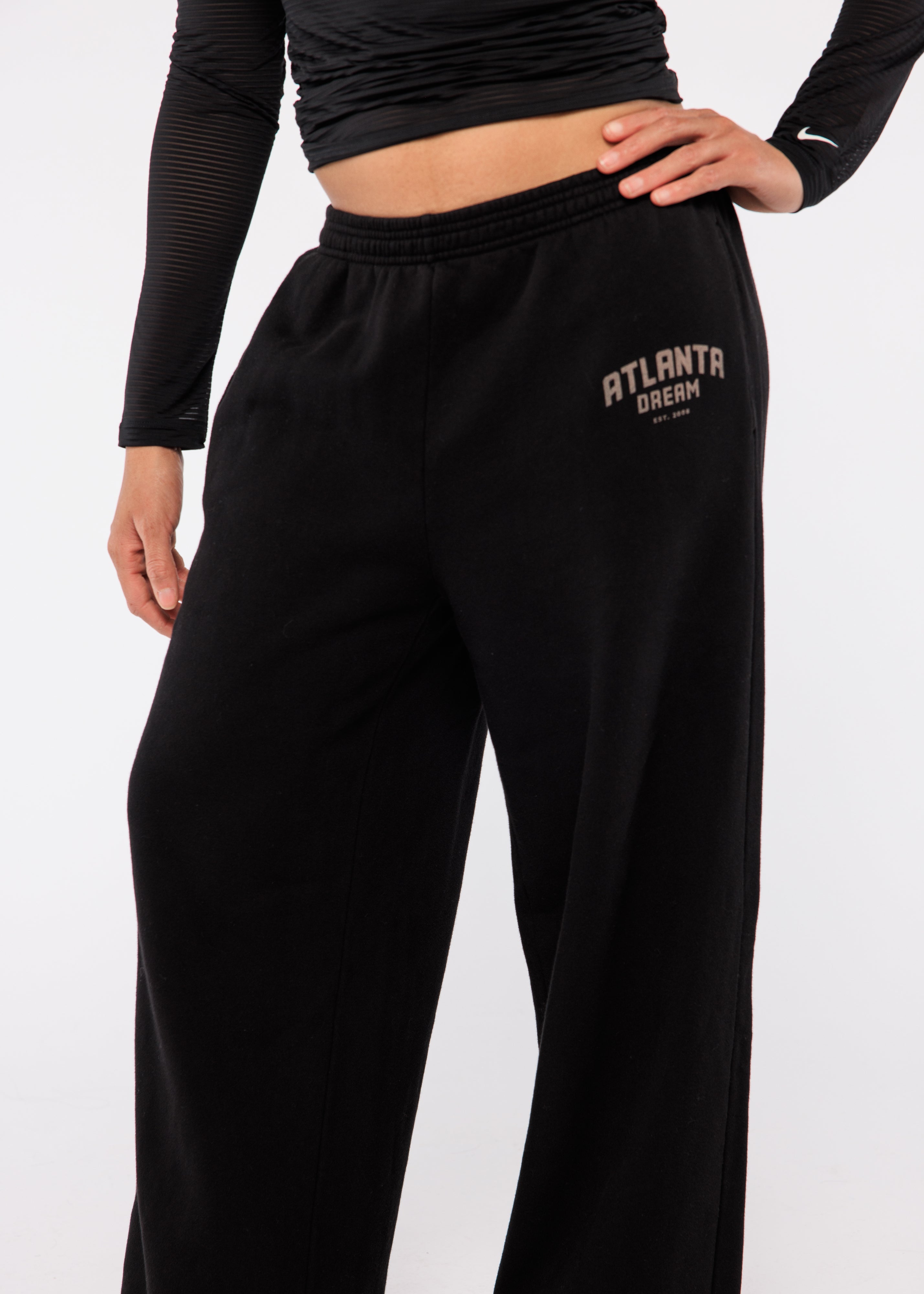 Black sweatpants with 'Atlanta Dream' text 