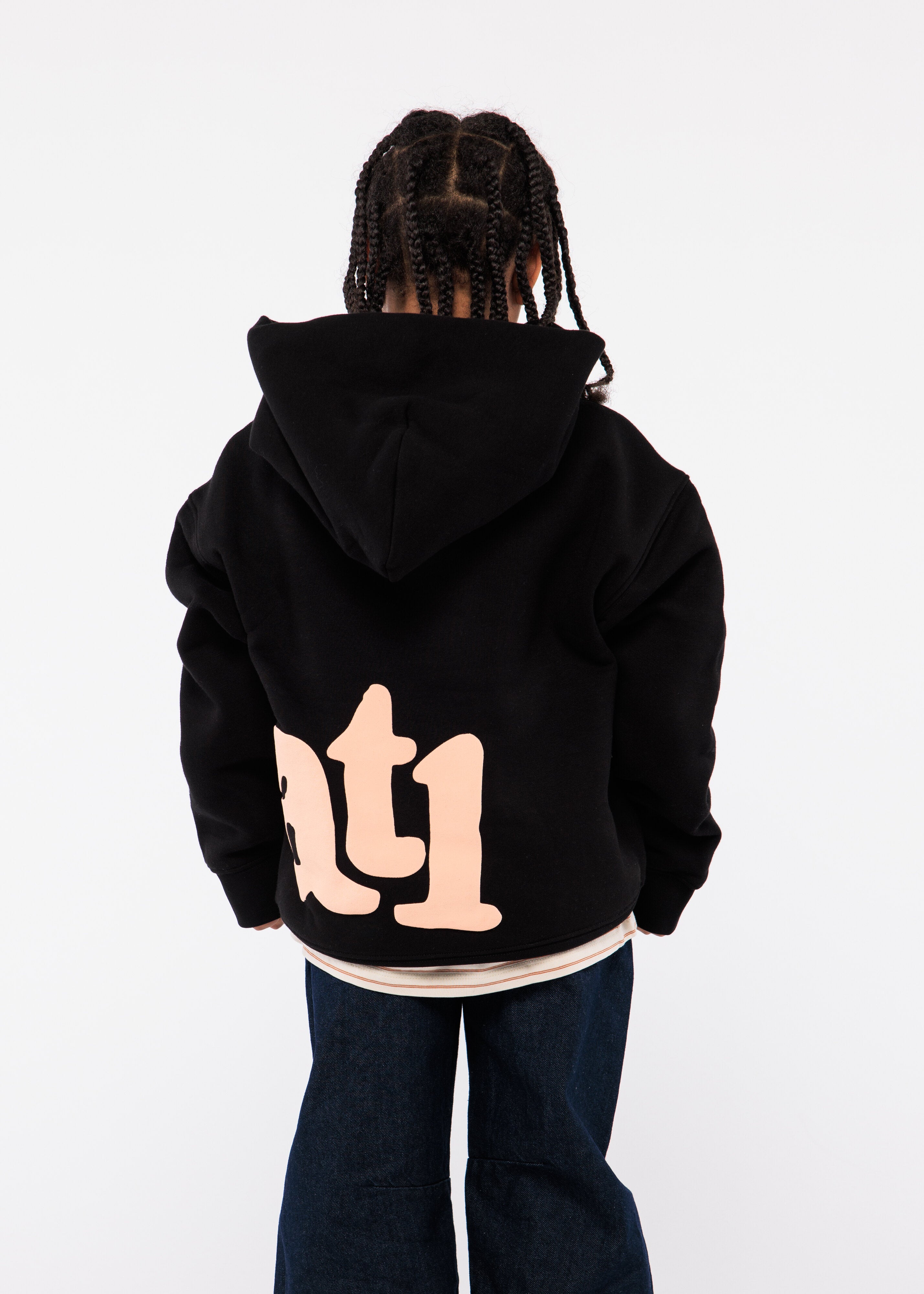 Person wearing a black hoodie with 'atl' logo on the back 