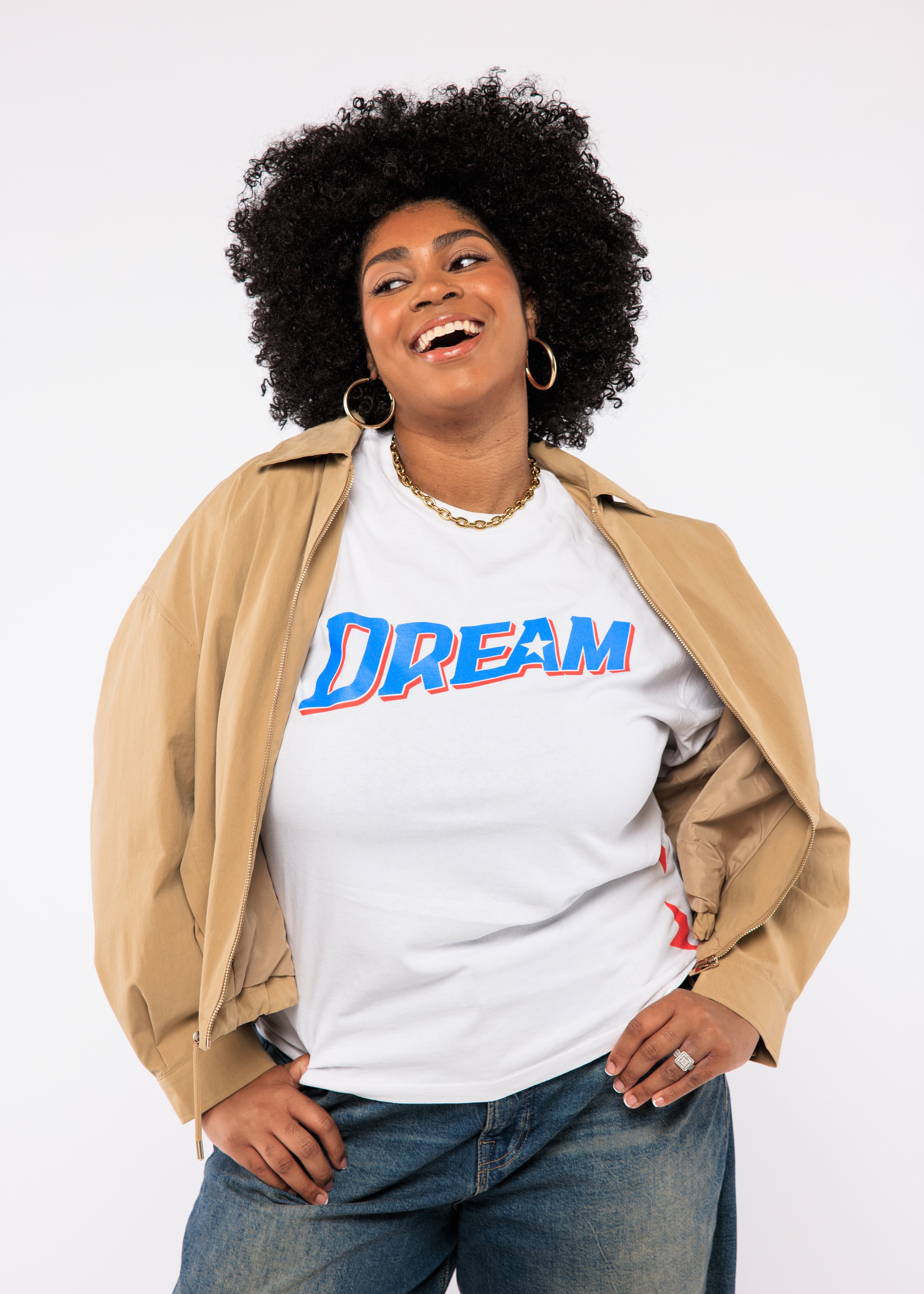 Wearing a white t-shirt with 'DREAM' printed on it