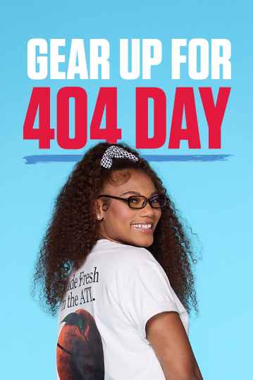 Person wearing a white t-shirt with a graphic design on a blue background with text 'Gear Up for 404 Day'.