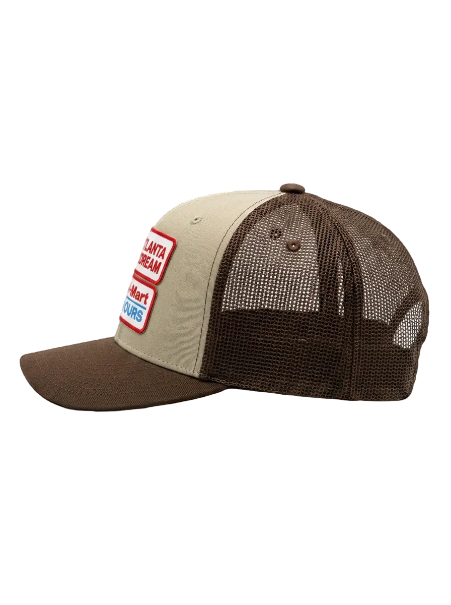 Two-toned brown hat with two patches on front reading "Atlanta Dream" and "404-Mart 24 Hours" 