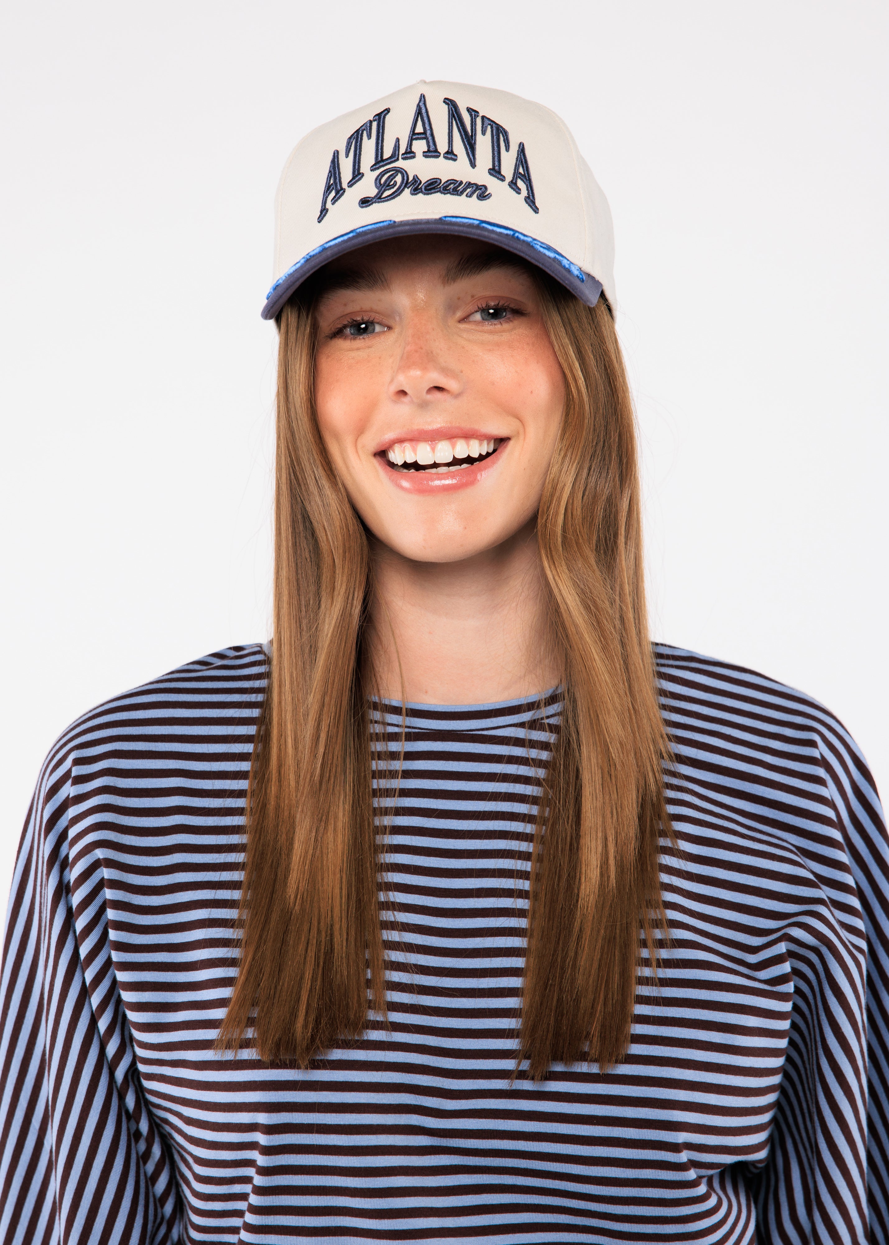 Person wearing a cap with 'Atlanta Dream' text