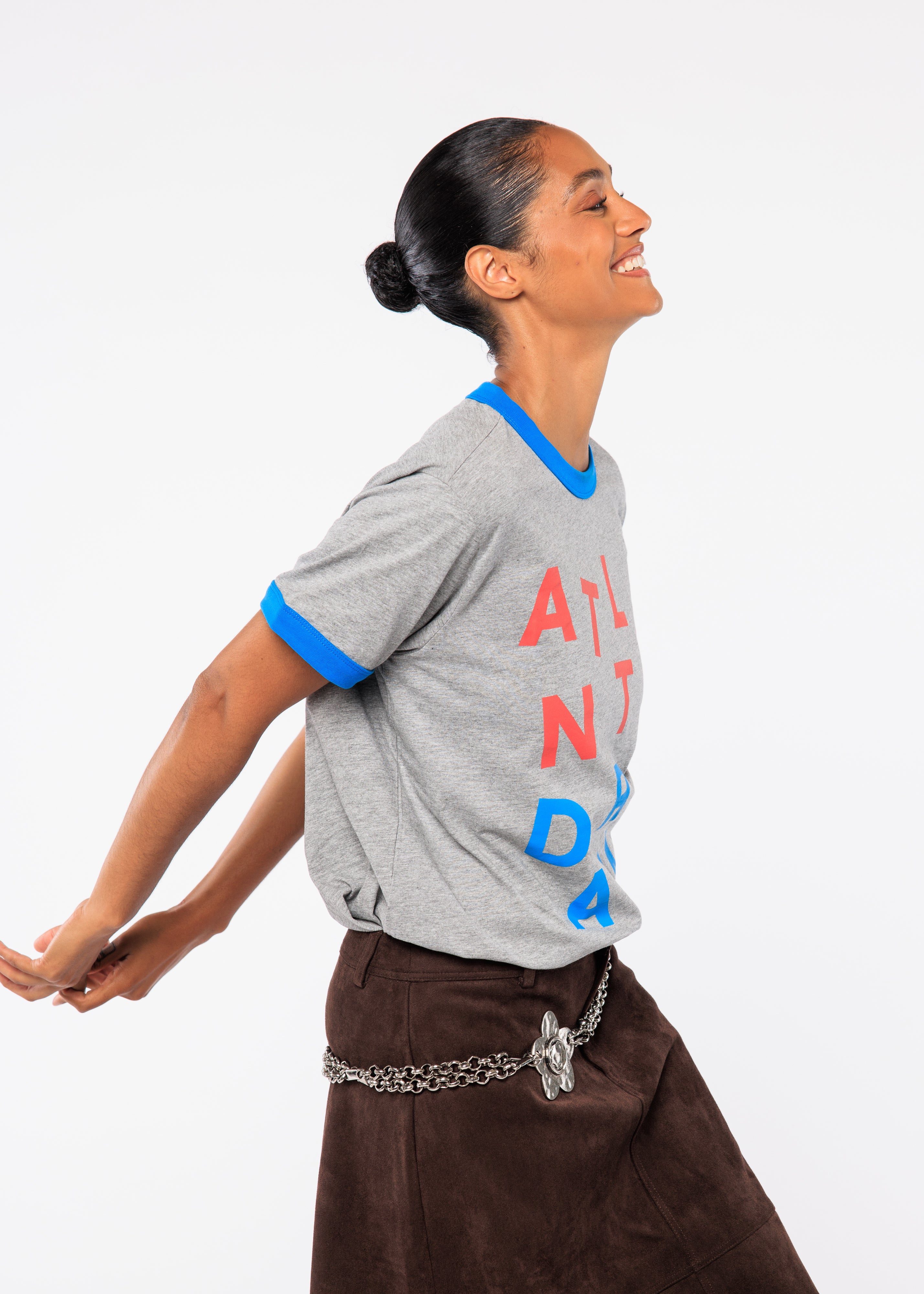 Woman wearing a gray t-shirt with 'Atlanta' printed on it 