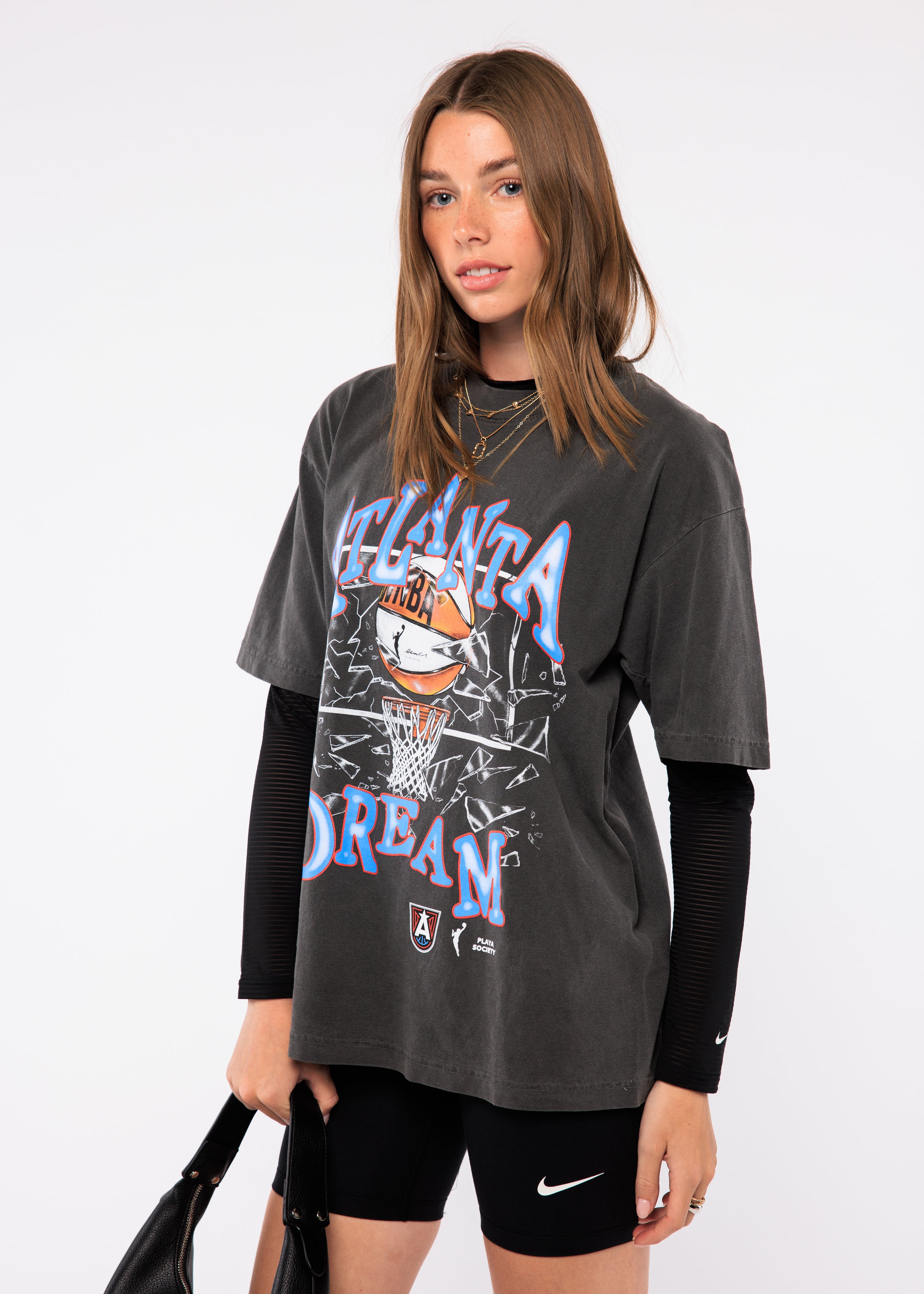 Wearing a graphic t-shirt with text and logos
