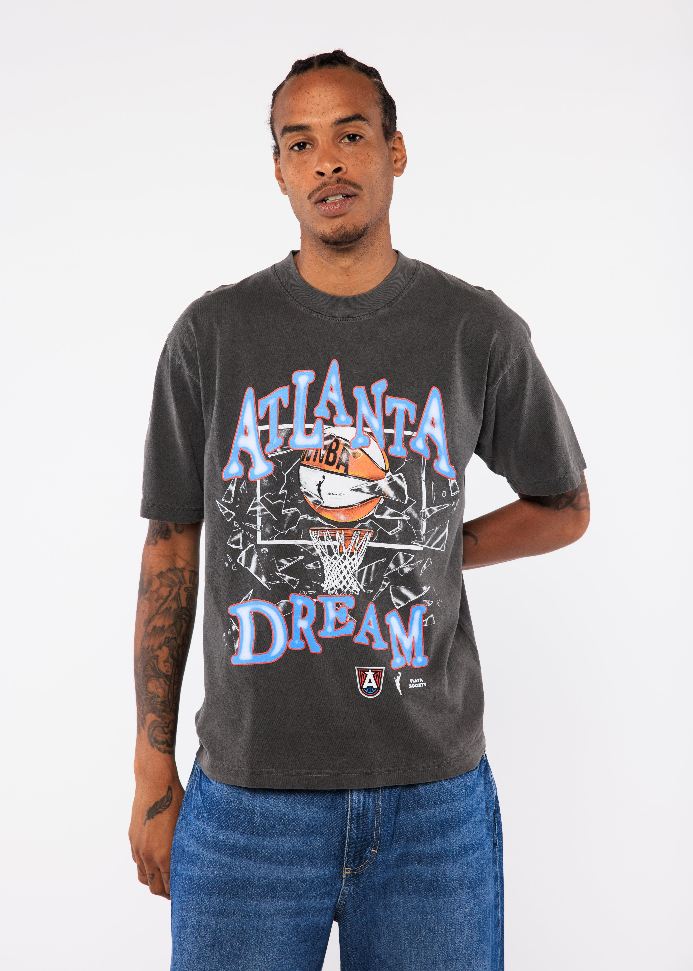 Wearing a gray t-shirt with 'Atlanta Dream' graphic design